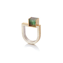 18k yellow gold and sterling silver U-shaped ring with an offset bi-color green and peach tourmaline cube, 8mm (predominately green). Ring is a size 8 and can be stacked with the offset bi-color pink tourmaline ring and U-shape diamond bar ring.