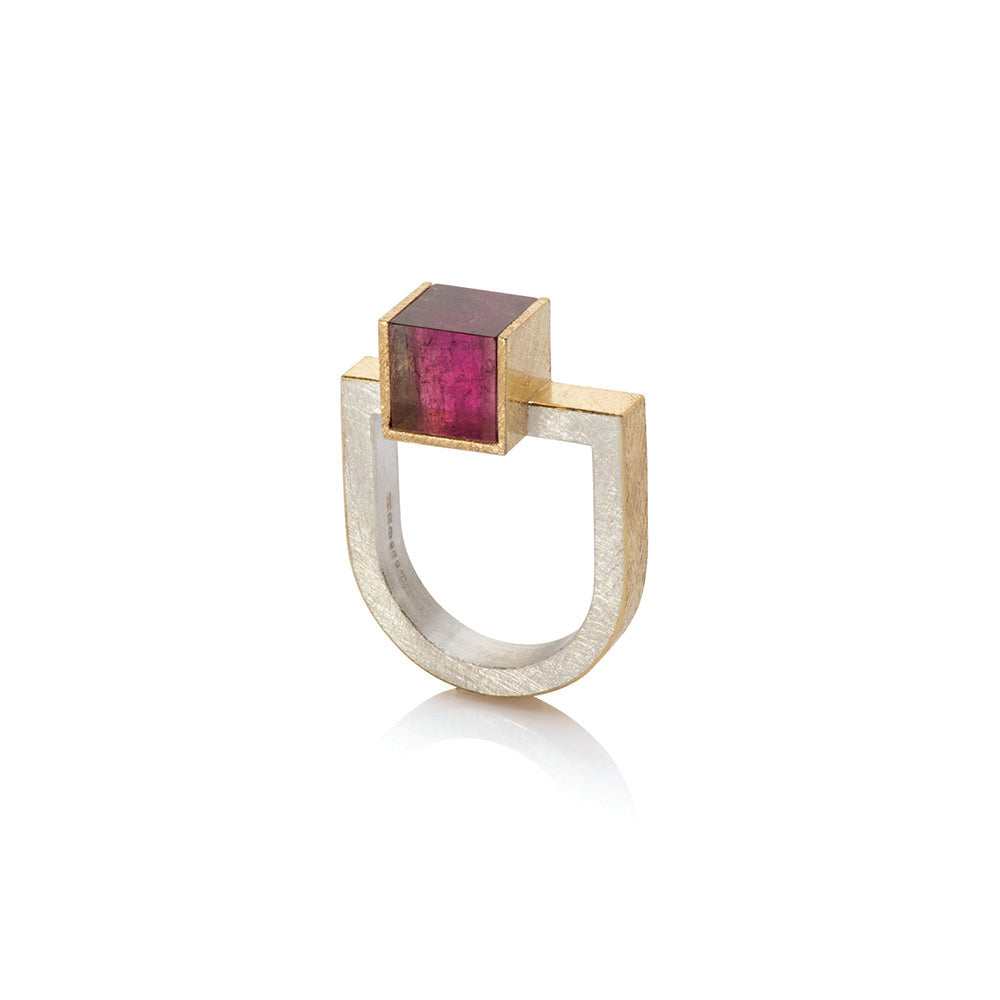 18k yellow gold and sterling silver U-shaped ring with an offset bi-color pink tourmaline cube, 8mm. Viewed from the top, cube is pink, viewed from the side, hints of watermelon tourmaline appear. Ring is a size 8 and can be stacked with the offset bi-color green and peach tourmaline ring and U-shaped diamond bar ring.