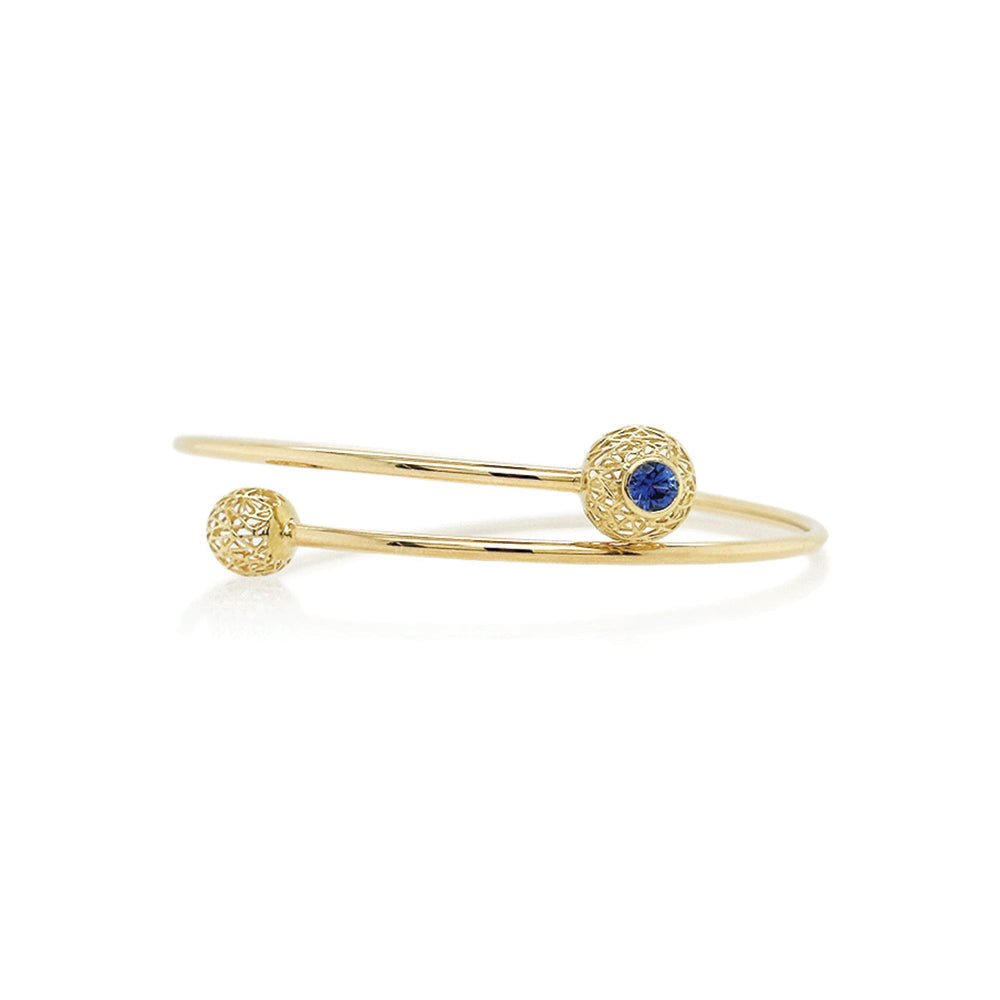 Blue sapphire cuff bracelet with gold spheres