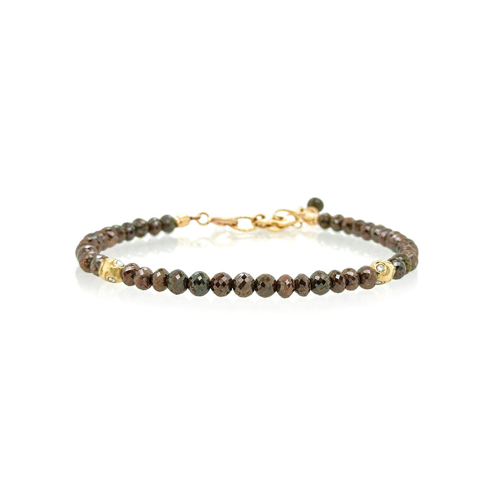 Chocolate diamond faceted bead bracelet, approximately 20 cttw, with 18k yellow gold owl spacer beads with VS White diamonds. Bracelet is 7" long with a 1 3/4" extension chain and lobster clasp. Diamonds are graduated 4mm-4.5mm.