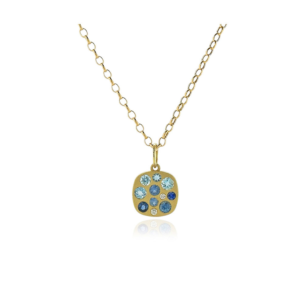 "Giselle" necklace with aquamarines, .26 ctttw, and blue sapphires, .38 cttw, on a 17" long 18k yellow gold chain with lobster clasp. 