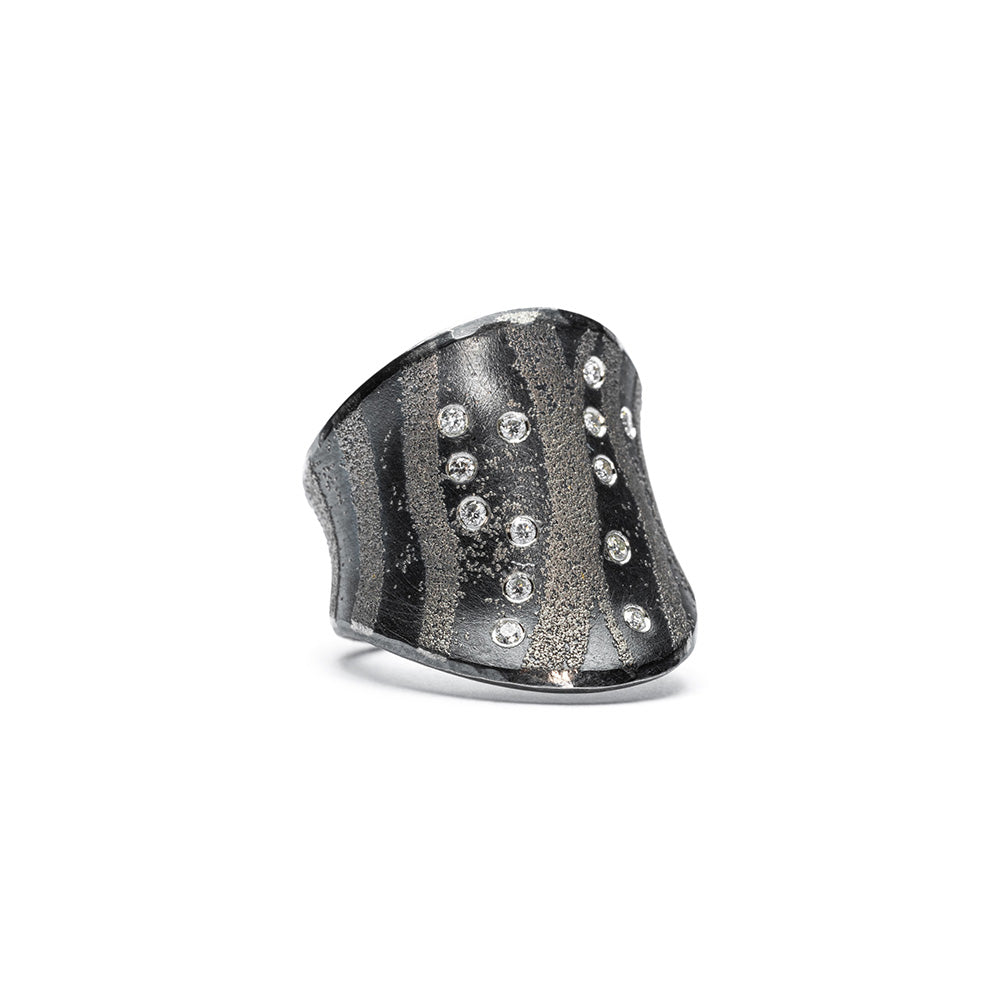 Oxidized sterling silver ring with platinum accents and white (G) diamonds, vsi, 0.13 cttw. Ring is 20mm (7/8") at its widest and is a size 5.75.