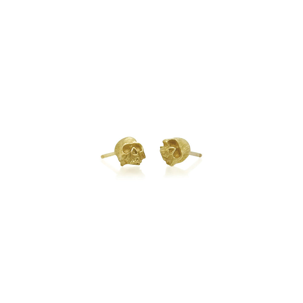 Hand-carved 18k yellow gold skull stud earrings. Skulls are 1/4" in diameter (6mm).