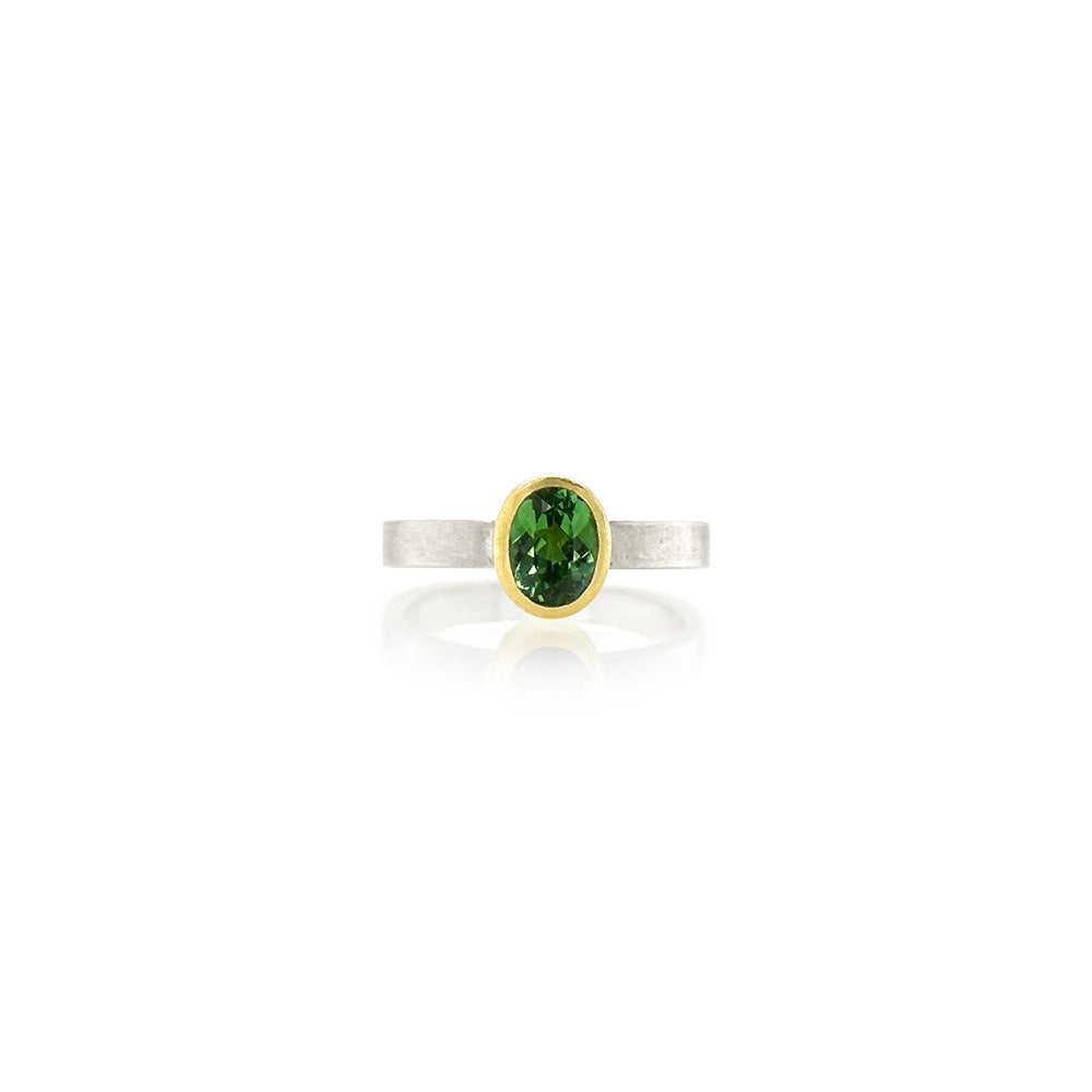 Oval faceted green tourmaline ring, 8mm x 5mm, set in 22k yellow gold on a square sterling silver ring shank, 3mm wide, ring size 6.75.