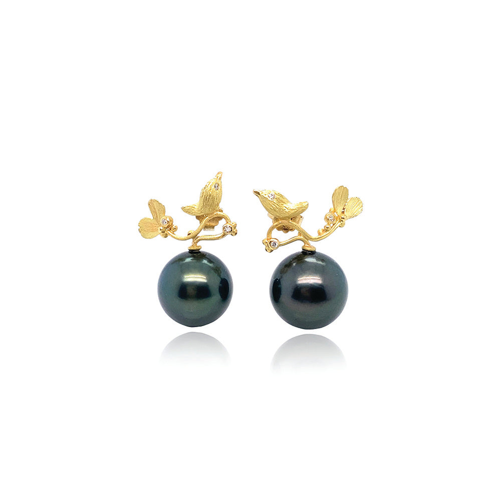 Hand-crafted 18k yellow gold birdie earrings with diamond eyes and accents, 0.06cttw, and a black Tahitian pearl, on posts. Earrings are 22mm wide x 24mm long. 