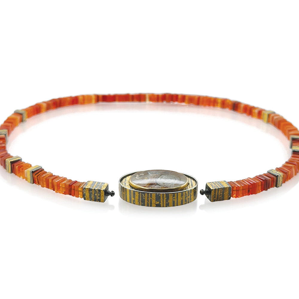 Quartz with pyrite sun disc, cut by Atelier Munsteiner, set in oxidized sterling silver with 22k &amp; 24k gold, white (G) vs diamonds, 0.15cttw, Vario clasp, with a Mexican Fire Opal strand, 18.5grams, and spacer beads.
